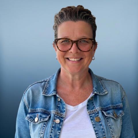 Tiffany Houston, woman wearing jean jacket and glasses