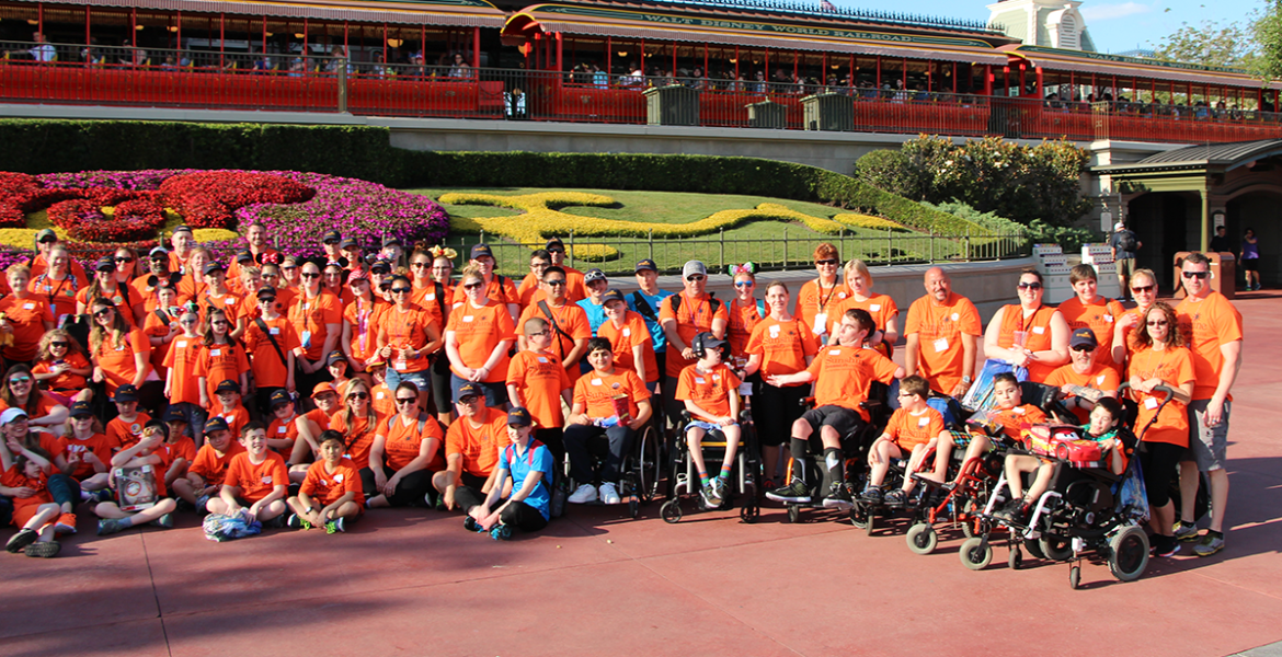 DreamLift London 2018 Group Photo in front of the train at the entrance to Magic Kingdom at Disneyworld