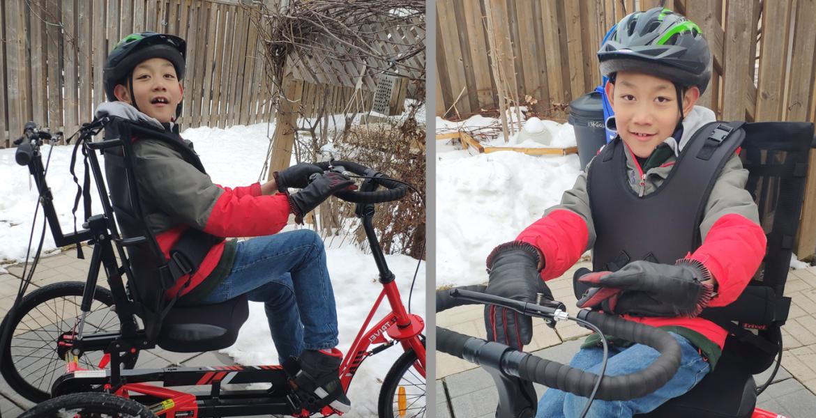 Albert seated in new tricycle outside in winter