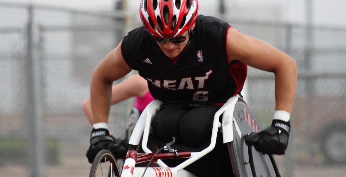 Close up of Austin Smeenk competing in customized racing chair