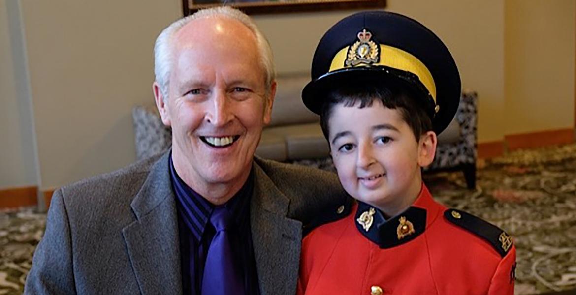 Daryl next to Shine DreamLift participant Casey who is dressed in RCMP regalia